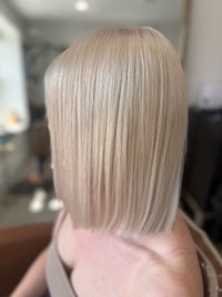 a woman with blonde hair in a salon