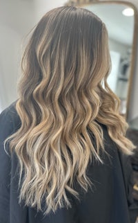 the back of a woman's hair in a salon