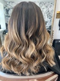 the back of a woman's hair in a salon